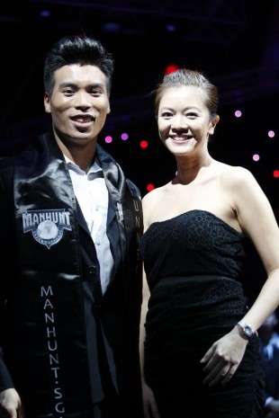 MANHUNT MOMENT: Faiz poses next to celebrity judge Michelle Chong. 