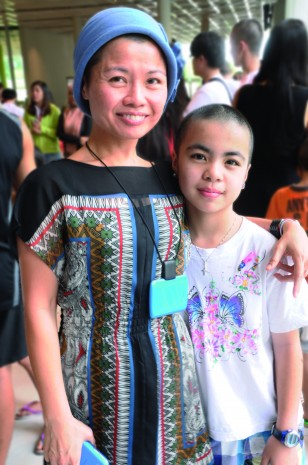 SHAVING IT OFF: RP facilitator Cecilia Ow and her daughter went bald together at this year’s Hair For Hope. The rest of their family had their hair cut as well. (Photo: Valerie Priya)