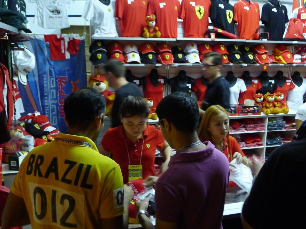 MERCHANDISE MANIA: Fans mulled over the merchandise of their favourite teams. (Photo: Shahida Ariff)