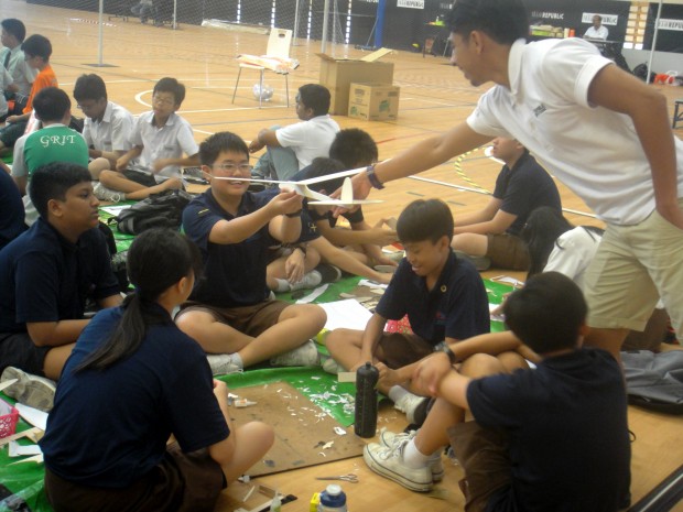 I BELIEVE I CAN FLY: Students test out their flying machine during the GliderFest competition. (Photo: Samantha Loh)