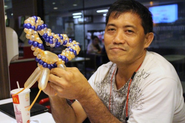 THE BALLOON MAN: Mr Gabriel Goh Ming Loong, is named ‘The Balloon Man’ for being seen at Causeway Point McDonald’s almost every evening. (Photo: Alice Lok)