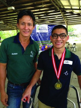 NO BARRIERS: Hazrin Chong (left) has been training Naren in horseback riding since October 2013, and helped Naren achieve the latest of his three winning medals. PHOTO: NAREN SANKAR