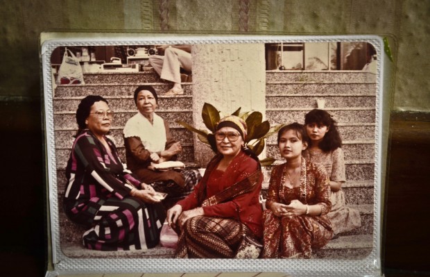FIRST TIME IN SINGAPORE: This picture was taken at World Trade Centre ferry terminal, when Mdm Sunemah (extreme left) first stepped onto Singapore shores. Her mother-in-law (extreme left) was her first point of contact besides her husband. (Photo courtesy of Madam Sunemah Palok)