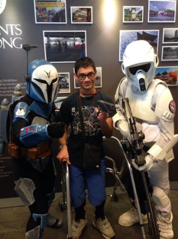 STAR WARS FANS, WE ARE: The reporter poses with participants dressed as Star Wars characters at Jurong Library. (Photo courtesy of Naren Lee Sankar)