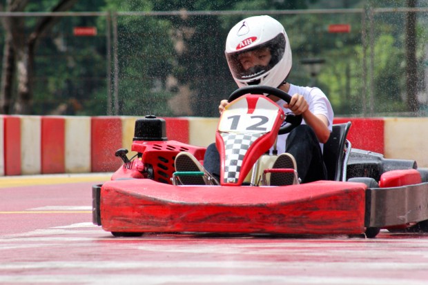 RAIN OR SHINE: The rain is no hindrance to the racers as they aim to clock the fastest time. (Photo: Natasha Hadi Chua)