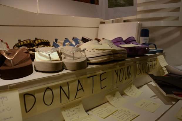 SOLE FOOD: A selection of the shoes donated to the children in Cambodia, with post-it notes below containing well wishes from RP staff and students to be given to the children.
