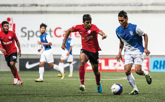 GOING FOR THE WIN: Anumanthan (in red) kicks for the national at the 2015 SEA Games. (PHOTO: Sleague.com)