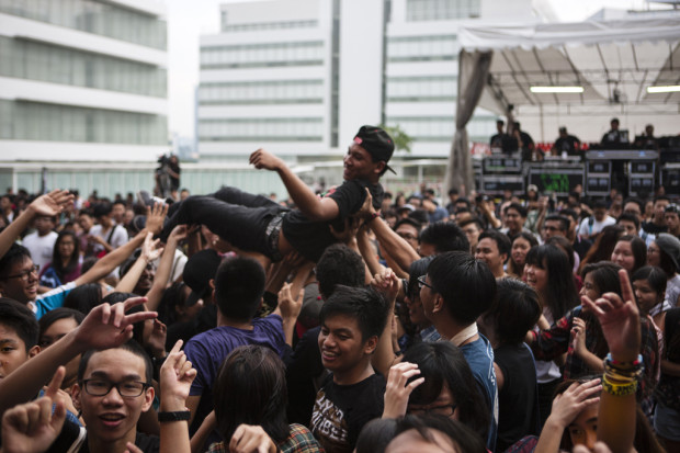 SWEPT UP IN THE MOMENT: Enthusiastic members of the audience crowd-surf. (