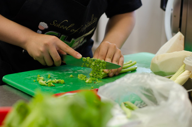 CHOP ME UP: A finalist shows exemplary skills in chopping a handful of long beans. (Photo: Marcus Benedict Tan)