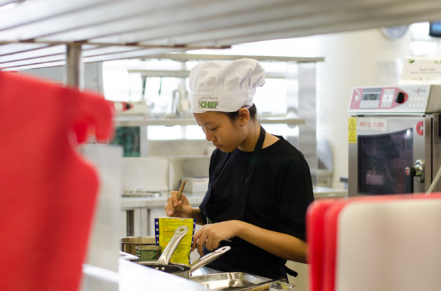 CORNY CONCOCTION: One of the teams prepares their special traditional corn dessert. (Photo: Marcus Benedict Tan)