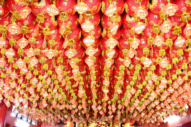 SEA OF LANTERNS: Red lanterns hang on the ceiling of the temple. Each of them contains donations from worshippers praying for prosperity. (Photo: Emmanuel Phua)