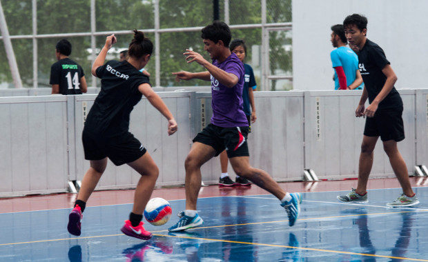 GIRL POWER: To be part of BRAG, each team had to consist of a few girls. Even though it was a game where boys were bound to pull each, they gave up their pretty dresses and tried their best to dribble the ball and pass it to their team mates, hopefully to assist a goal. (Photo: Nur Humaira Wahab)