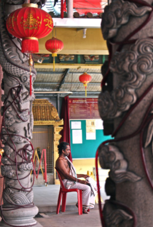 UNDER ONE ROOF:  An old friendship between two temples, the Hindu and Chinese temple goes a long way back to more than sixty years ago in the Hup Choon Kek Village. (PHOTO BY: Geneieve Teo)