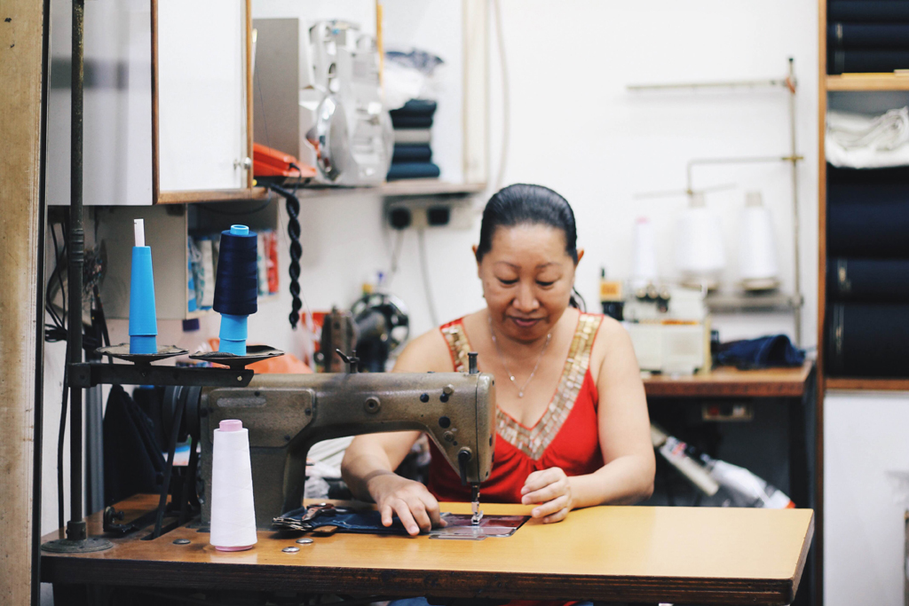 Stitching Up The Memories: With over 3 decades of experience, Ms Chong is an expert in the tailoring industry. The only disappointment her loyal customers will face is if she decides not to relocate when the building is due to close. (Photo: Sabrina  Muhleseddin)