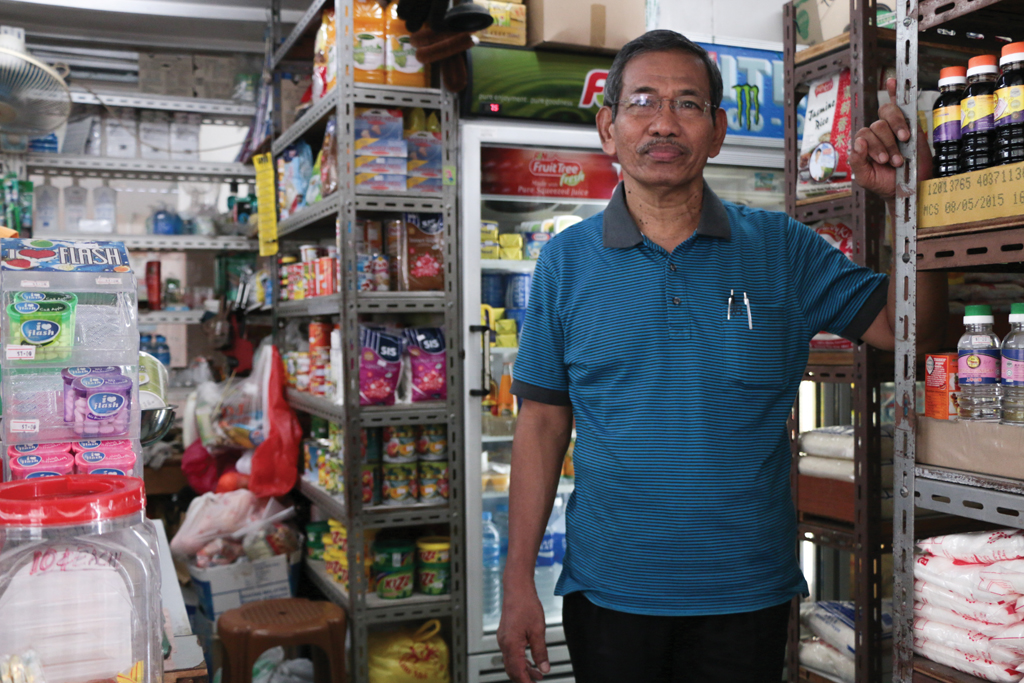 VANISHING TRADE: Mr Aruldas in his ‘mama shop’. ‘Mama shops’ like this are a rare sight in contemporary Singapore, with modern convenience stores taking over its popularity in recent years. Photo: Azmi Athni