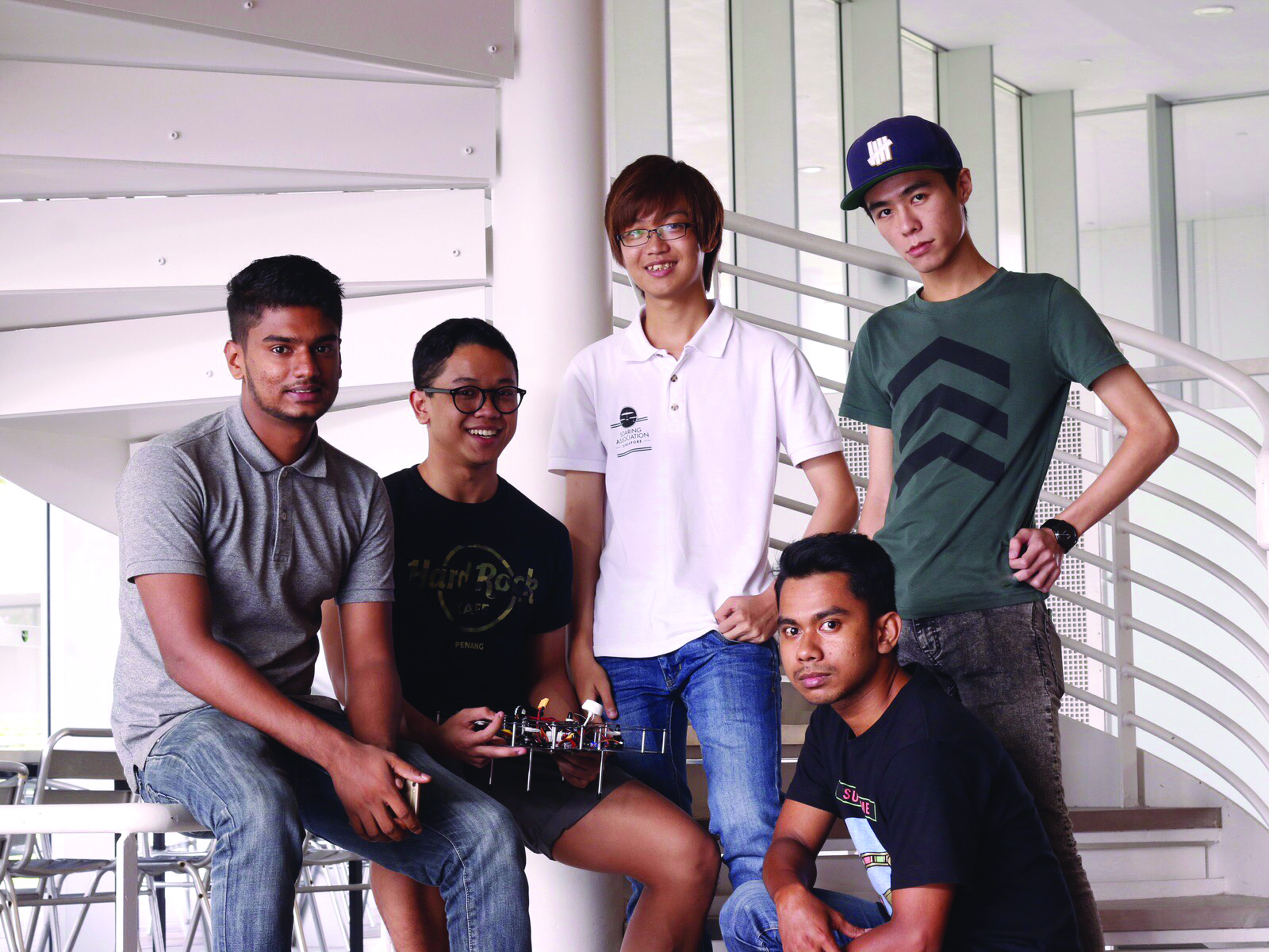 FLYING HIGH: The team of five students (from left to right: Pulendrarajah Gowreesan, Ameerul Hakim Bin Mustapha Kamal, Lau Qi Xuan, Muhammad Nazri Bin Hazis, Marcus Tay Yi Ming) from the Diploma of Aerospace Avionics hopes to bag the top prize at the Singapore Amazing Flying Machine Competition held between March 7 till March 19. (Photo Courtesy : Pulendrarajah Gowreesan)