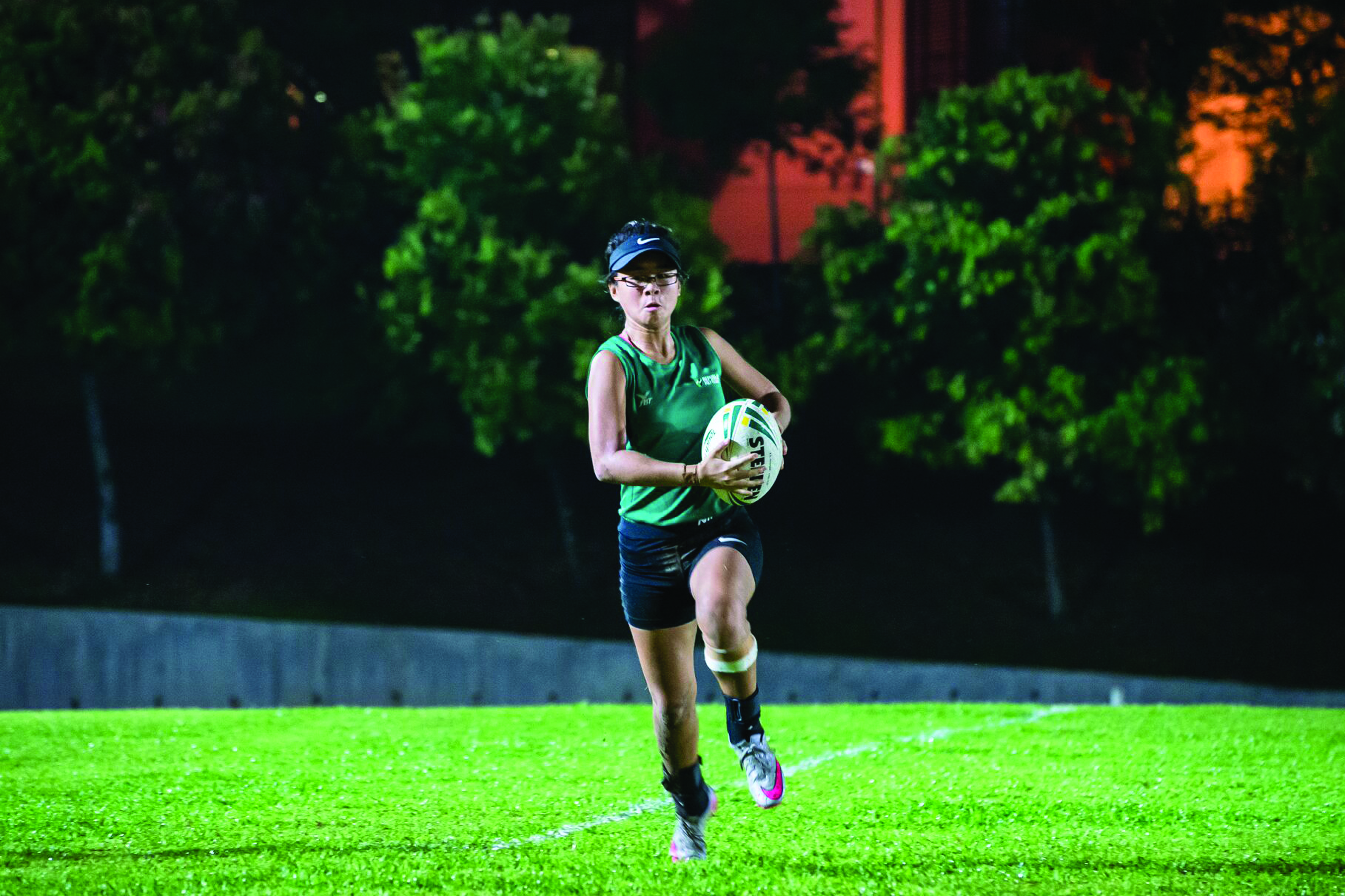 ON THE BALL: Touch Rugby player Tessa Amanda Sa’at, 19, spends six days a week preparing for the Polytechnic- Institute of Technical Education (POL-ITE) Games. Tessa feels a player needs humility, passion and determination to be a top sportsman. PHOTO: Zaini Qayyum