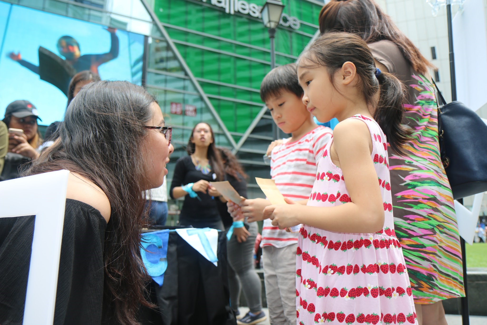 UNDERSTANDING DIFFERENCES AND ACKNOWLEDGING SIMILARITIES: It's never too early or too late to talk about the importance of playing an active role in making Singapore a better home by understanding the differences and embracing similarities. With the companion of their mother, both children shared and learned more about why acceptance is important in a cosmopolitan country like Singapore. (Photo: Joan L Koh Jia Min)