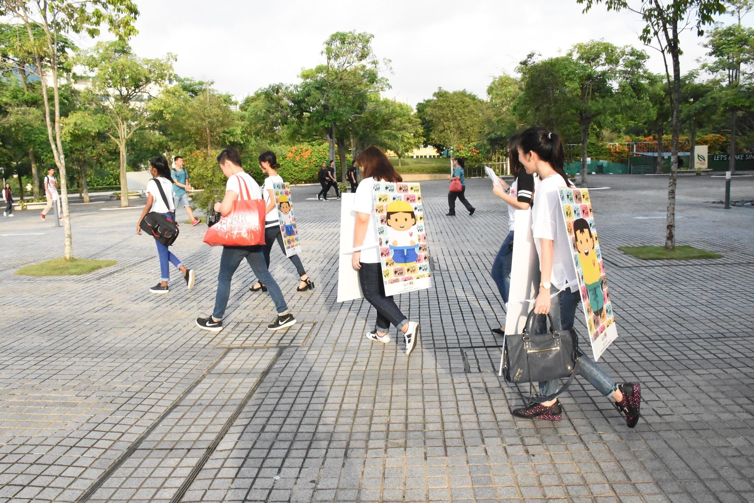 NEVER TOO EARLY: The students involved in ThatsWhy believed that for social integration to be successful, the community must first learn to understand and cultivate racial respect for one another. As early as 7.30am on Aug 4,  22 students were despatched to Woodlands, Admiralty and Sembawang to promote social integration to residents of Sembawang GRC. (Photo: Dawn Lee Shi Han) 